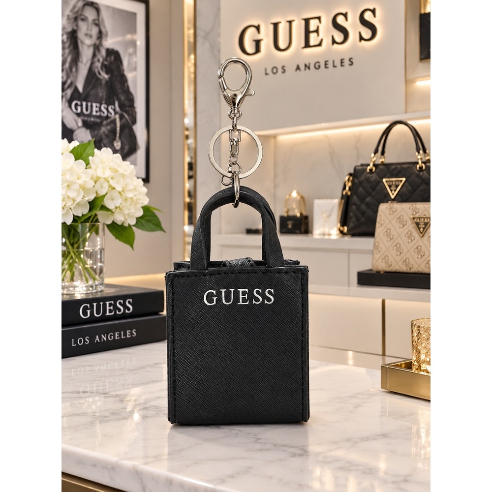 #17 Guess bag charm